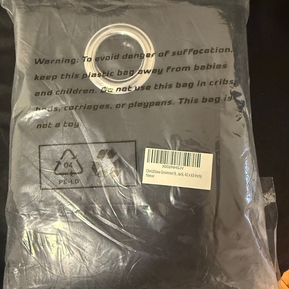 Black, black out curtains. Still in it original package